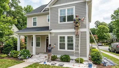 Professional house painters working on exterior home in Raleigh NC